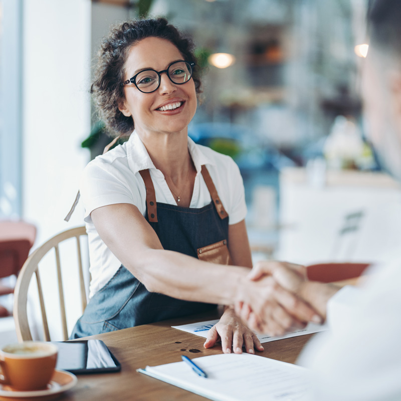 business woman shaking hands with someone